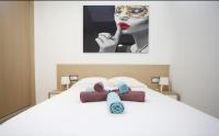 A bed or beds in a room at Albatros Playa Club