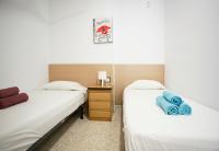 A bed or beds in a room at Albatros Playa Club