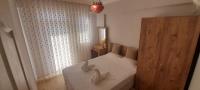 Postel nebo postele na pokoji v ubytování Villa Palm Tree