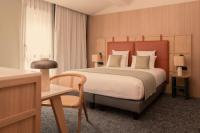 Posteľ alebo postele v izbe v ubytovaní Hôtel Parc du Landreau
