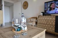 Televízia a/alebo spoločenská miestnosť v ubytovaní T2 Dolce Vita - Vue Mer, Piscine & Plage
