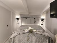 A bed or beds in a room at Vacations in Patra Studios