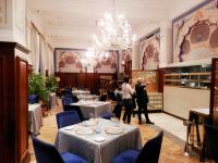 a dining room with tables and chandeliers at Taj Cape Town - Spacious 5 star luxury residence with kitchenette in Cape Town