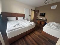Hotel Capitol Zentrum - 24h -にあるベッド