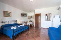 A bed or beds in a room at Tenuta Ricco With Pool And Garden