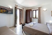 A bed or beds in a room at Tenuta Ricco With Pool And Garden