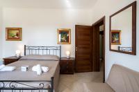 A bed or beds in a room at Tenuta Ricco With Pool And Garden
