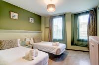 A bed or beds in a room at Hotel de Riu Boutique