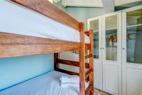 A bed or beds in a room at Hotel de Riu Boutique