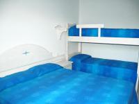 A bed or beds in a room at Baia Fiorita