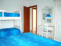 A bed or beds in a room at Baia Fiorita