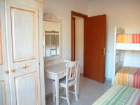 A bed or beds in a room at Baia Fiorita