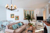 A television and/or entertainment centre at Villa Punta del Sole