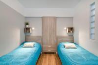 Posteľ alebo postele v izbe v ubytovaní Apartment Masarska