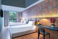 Een bed of bedden in een kamer bij ibis Styles Kuala Lumpur Bukit Bintang