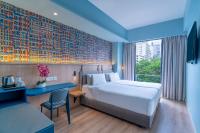 Een bed of bedden in een kamer bij ibis Styles Kuala Lumpur Bukit Bintang