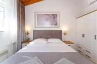Postel nebo postele na pokoji v ubytování Villa Zlatni dvori ZadarVillas