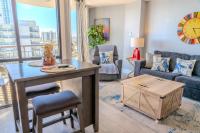 ein Wohnzimmer mit Tisch und Couch in der Unterkunft Ocean View Double Suite! Sleeps 4 Meridian Plaza 705 in Myrtle Beach