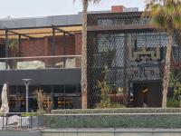 a building with a sign on the side of it at Iconic Stay Four Seasons View in Manama