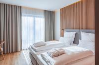 Postel nebo postele na pokoji v ubytování Magnetit Hotel Šumava