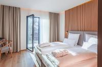 Postel nebo postele na pokoji v ubytování Magnetit Hotel Šumava