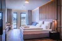 Postel nebo postele na pokoji v ubytování Magnetit Hotel Šumava