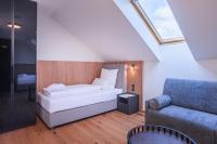 Postel nebo postele na pokoji v ubytování Magnetit Hotel Šumava