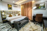 Ένα ή περισσότερα κρεβάτια σε δωμάτιο στο Roston Hotels