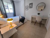 A bed or beds in a room at Cozy apartment in downtown area