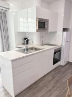 Kuchyň nebo kuchyňský kout v ubytování Apartamentos Carmela