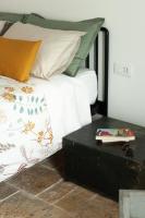 A bed or beds in a room at Casale Petrarolo