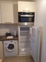 Kuchyňa alebo kuchynka v ubytovaní Appartement avec piscine proche plage et commerces