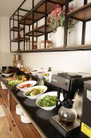 a buffet line with plates of food on a counter at Tress Hotel in Istanbul