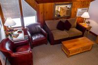 a living room with a couch and a chair at Kandahar Lodge at Whitefish Mountain Resort in Whitefish