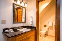 a bathroom with a sink and a toilet at Kandahar Lodge at Whitefish Mountain Resort in Whitefish