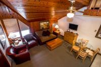 a living room with a couch and a table at Kandahar Lodge at Whitefish Mountain Resort in Whitefish