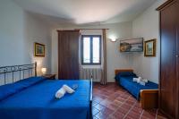 A bed or beds in a room at Tenuta Ricco With Pool And Garden