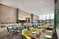 Restaurace v ubytování 峨眉山景区希尔顿欢朋酒店