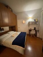 A bed or beds in a room at La dolce Frascati Home