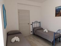 Łóżko lub łóżka w pokoju w obiekcie Villa Pinella