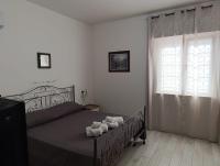 Łóżko lub łóżka w pokoju w obiekcie Villa Pinella