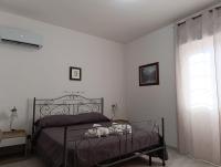 Łóżko lub łóżka w pokoju w obiekcie Villa Pinella