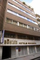 a building with a hotel sign in front of it at Monclús in Palencia