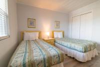 Ein Bett oder Betten in einem Zimmer der Unterkunft Windy Waves Top Location w Pool