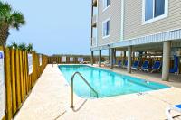 Der Swimmingpool an oder in der Nähe von Windy Waves Top Location w Pool