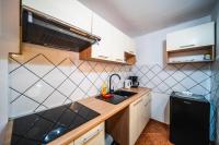 Kuchyňa alebo kuchynka v ubytovaní M & J Central Suites