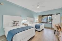 Ein Bett oder Betten in einem Zimmer der Unterkunft Beachside Inn