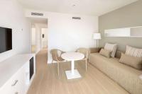 a living room with a couch and a table at Sol Fuerteventura Jandia - All Suites in Morro del Jable