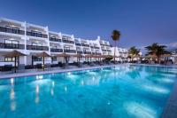 a large swimming pool in front of a hotel at Sol Fuerteventura Jandia - All Suites in Morro del Jable
