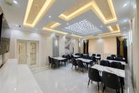 a dining room with tables and chairs and a ceiling at Isakhoja Boutique Hotel in Khiva